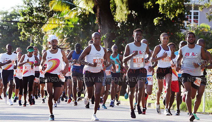 Runners take off in the Guardian Group SHINE Charity 5K and 10K yesterday at the Nelson Mandela Park, St Clair.