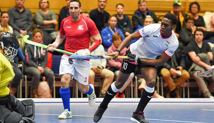 T&T’s midfield/forward Kristien Emmanuel, right, fires a shot towards Czech Republic goalkeeper Pavel Hraba, left, while Czech defender Ales Perinka looks on, during Wednesday’s encounter which T&T lost 7-2.