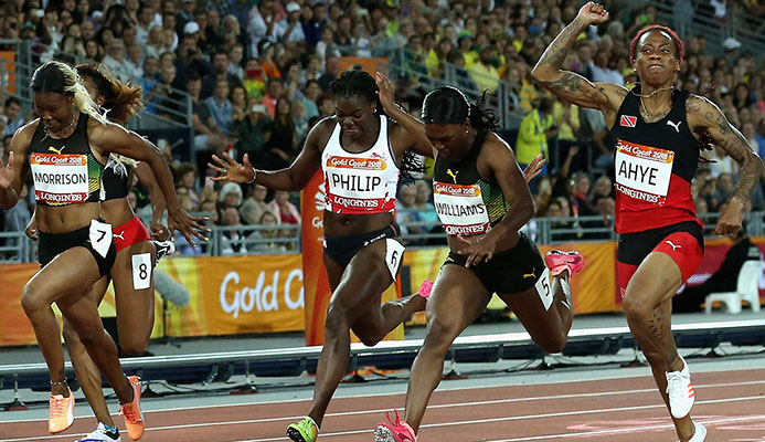 Michelle-Lee Ahye of Trinidad and Tobago celebrates as she wins gold ahead of Christania Williams of Jamaica and Asha Philip of England. Photo: Getty.