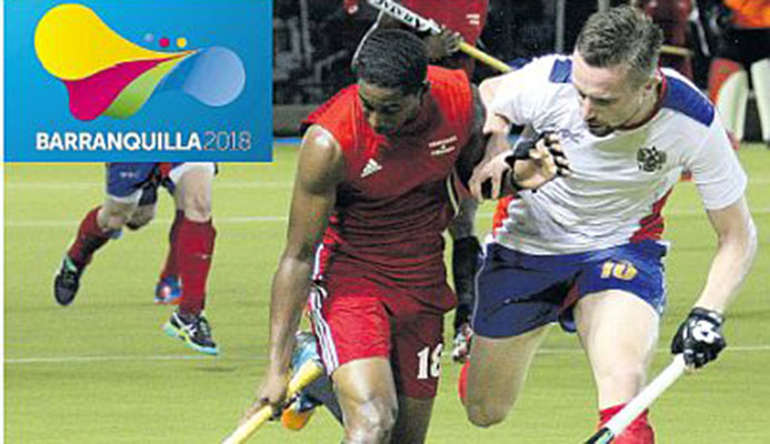 T&T’s Mickell Pierre, left, scored the equaliser for the national team against Mexico in the semifinals of the men’s hockey competition at the CAC Games in Barranquilla, Colombia, yesterday after the scores were tied 1-1 at the end of regulation. T&T went under to Mexico, 4-2 in a penalty-strokes shoot-out.