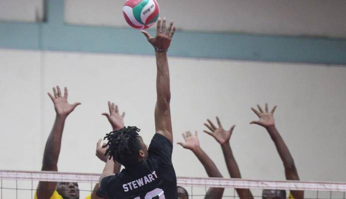 Triple T La Cura Sport’s Daynte Stewart stretches to connect with a spike as the Technocrats’ trio of Ryan Stewart, Newton Grant and Adriel Richards go up to block in their Men’s Division 2019 Office of the Prime Minister Premier Volleyball League match at the Central Regional Indoor Sports Arena, Chaguanas on Tuesday night. La Cura Sport won 25-16, 25-23, 20-25, 22-25, 15-10.  T&TVF