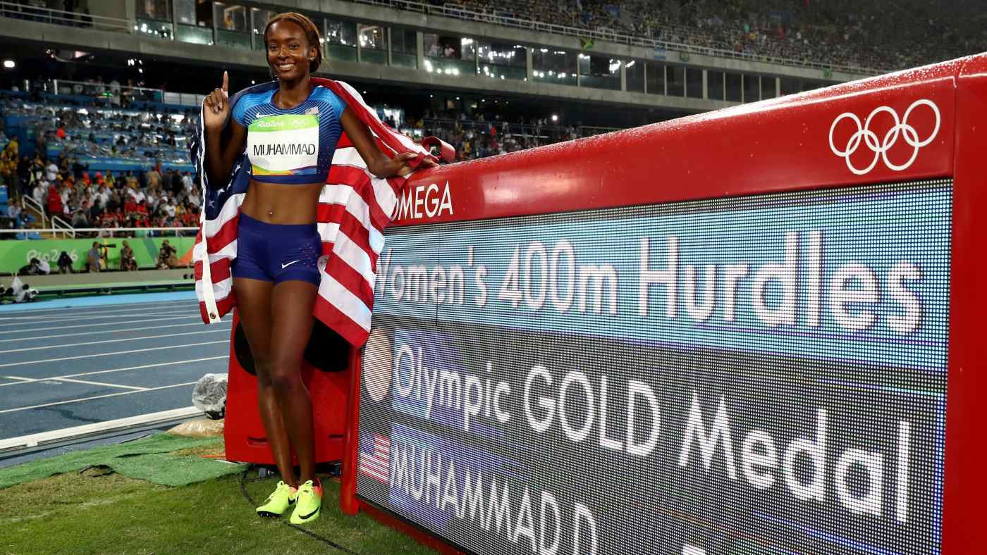 Dalilah Muhammad of the U.S. celebrates her gold medal in the women's 400m hurdles at the Rio 2016 Olympic Games on Aug. 18, 2016, in Rio de Janeiro.   © Getty Images