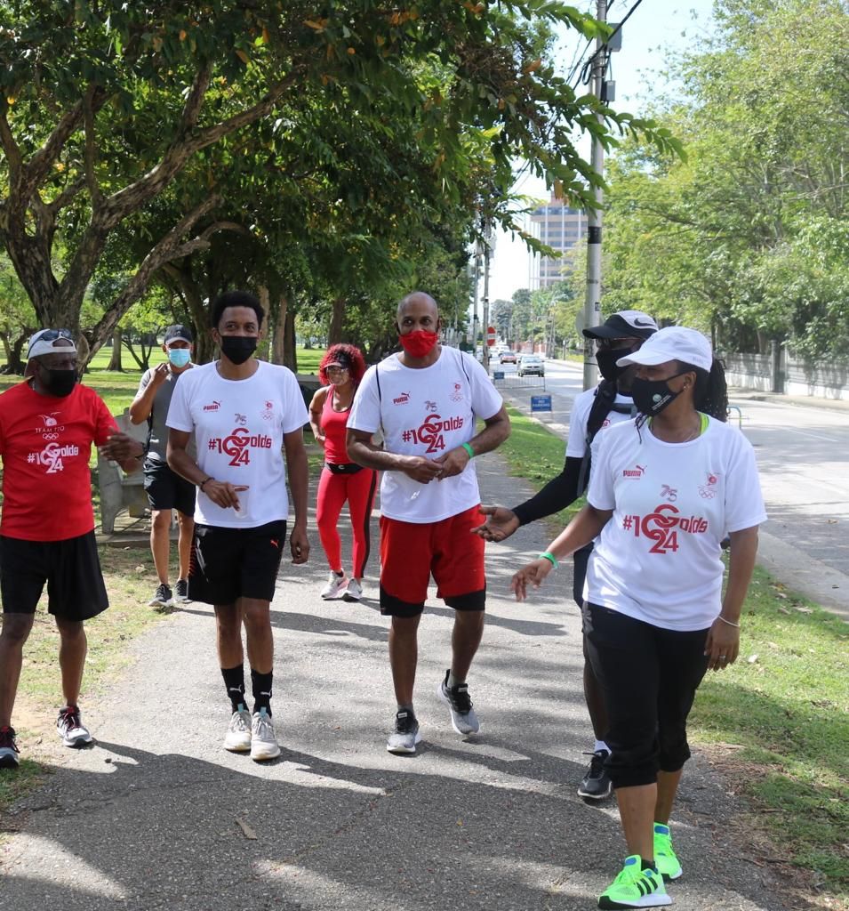 All masked TTOC walkers Anton Lafond, from left, TTOC president Brian Lewis, outgoing THA Secretary of Sport and Youth Affairs  Jomo Pitt, former Strike Squad captain and current TT Super League President Clayton Morris and Advisor to THA Secretary of Sport and Youth Affairs  Biana Edwards at the Queen's Park Savannah in Port-of-Spain during  Sunday's 26.2 mile TTOC Marathon Walk. Melanie Gulston/Team TTO Media