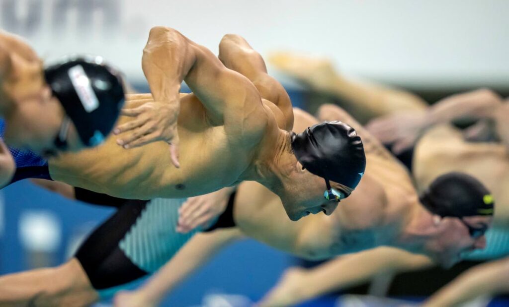 Dylan Carter of Trinidad and Tobago blasts out of the start blocks on his way to winning the men's 50m freestyle at the FINA Swimming World Cup meet in Toronto, on Friday. - via AP (Image obtained at newsday.co.tt)