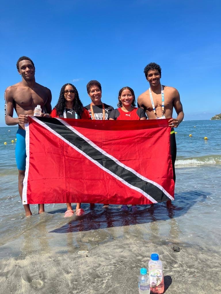 TT swimmers Nikoli Blackman, from left, Amelia Rajack, coach Maurice Faria, Shania David and Zachary Anthony. - (Image obtained via: newsday.co.tt)