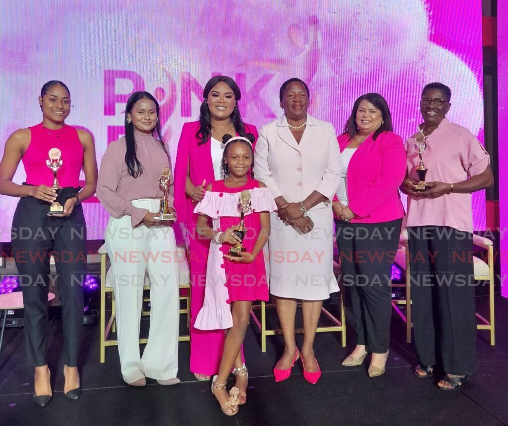 Minister of Sport and Community Development, Shamfa Cudjoe-Lewis (centre) and Minister of Planning and Development, Pennelope Beckles (second from right), with #GirlsRunTTChallenge participants at the launch of Pink Reign 2024 at the Hilton Trinidad and Conference Centre in January. - Photo by Roneil Walcott (Image obtained at newsday.co.tt)