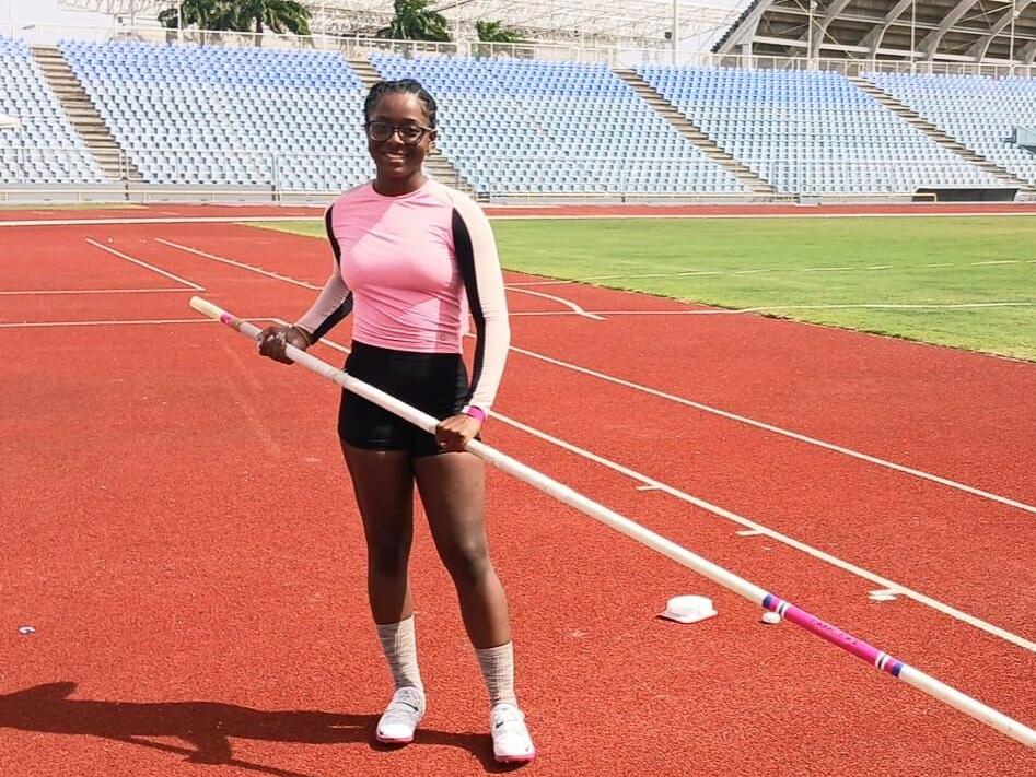 WELL DONE: Concorde’s Tessica Laurence is all smiles after achieving the Carifta Games Girls Open pole vault qualifying standard at the Hasely Crawford Stadium, Mucurapo, yesterday.  —Photo: KAIRIBELLESPORTS (Image obtained at trinidadexpress.com)